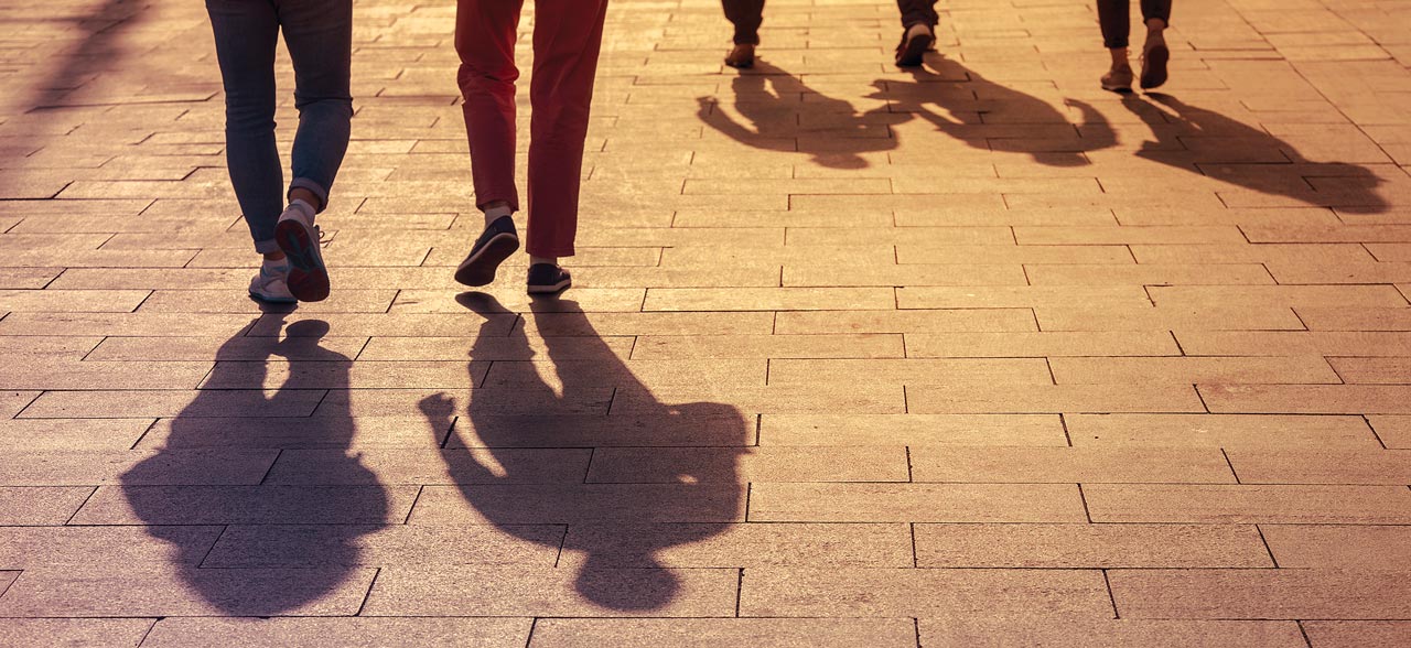Photo of shadows of people walking