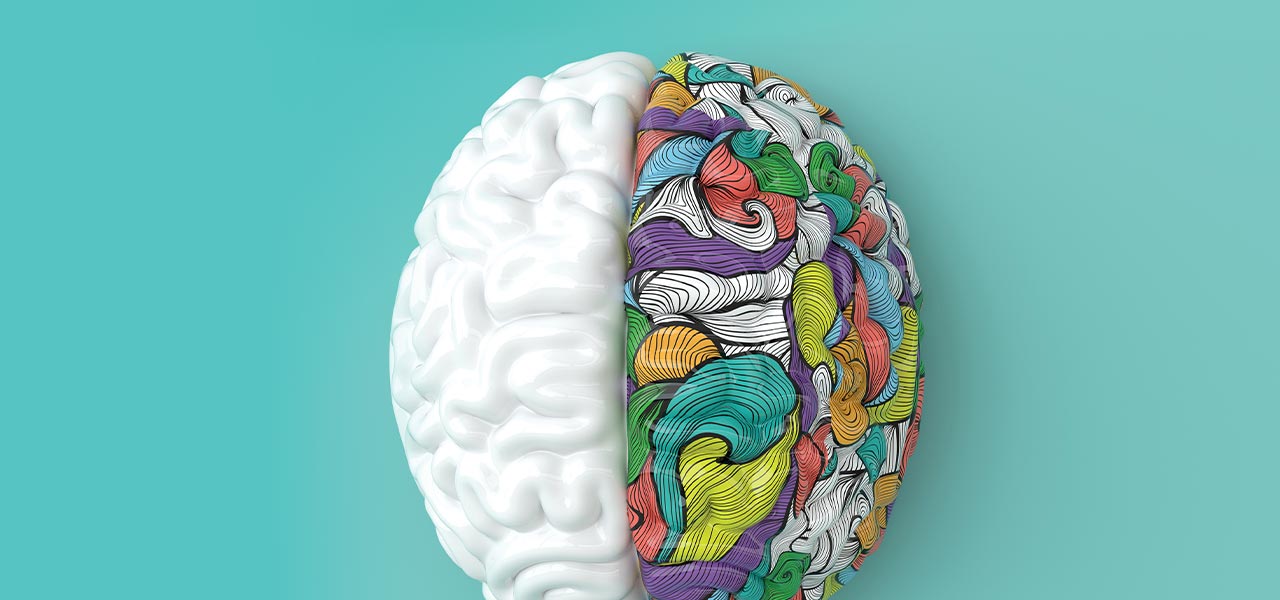 photo illustration of a brain with one side white and the other colorful and vibrant