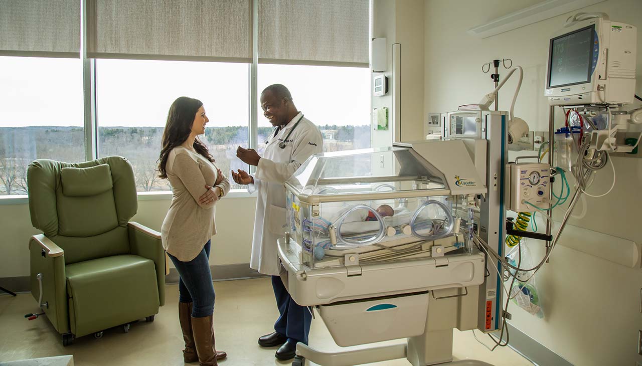 Doctor with mother at NICU