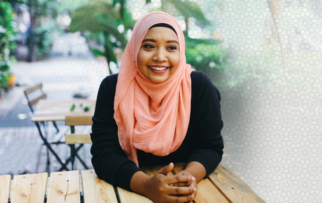 Photo of happy, young muslim woman