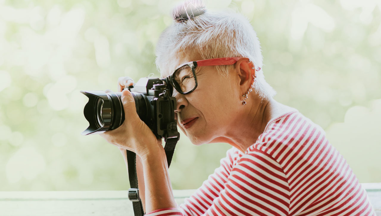 Image of senior woman taking a photo