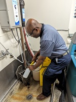 EVS foreman fills a bottle with the SAO solution