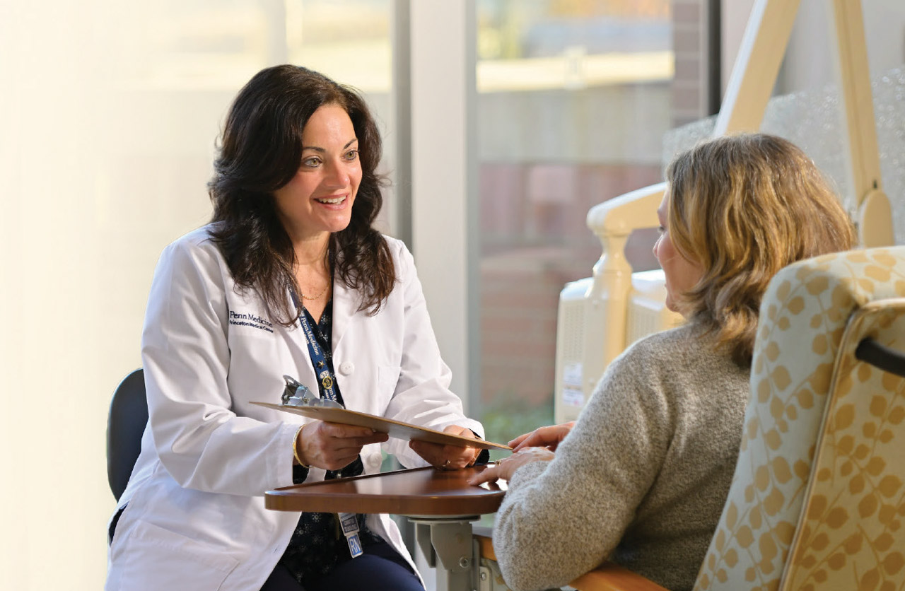 Photo of healthcare professional talking with patient