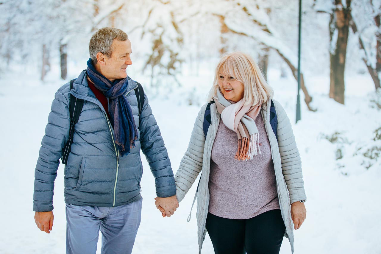 Photo of couple walking in snow