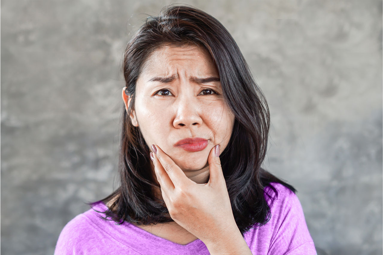 photo of woman with jaw pain
