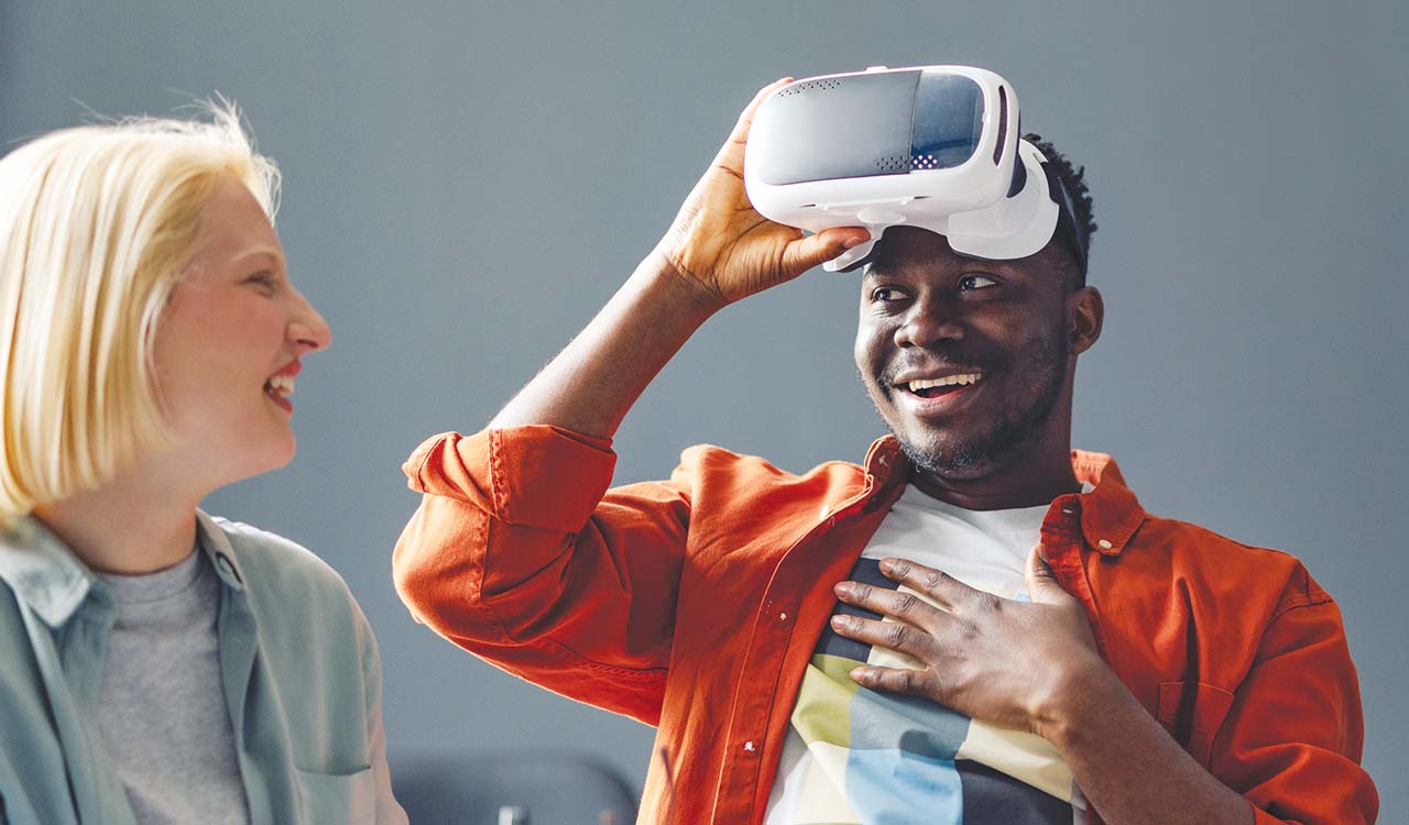 Photo of man wearing Virtual Reality goggles